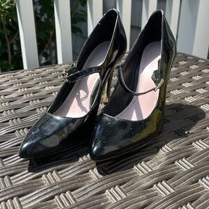 Black patent leather heels.